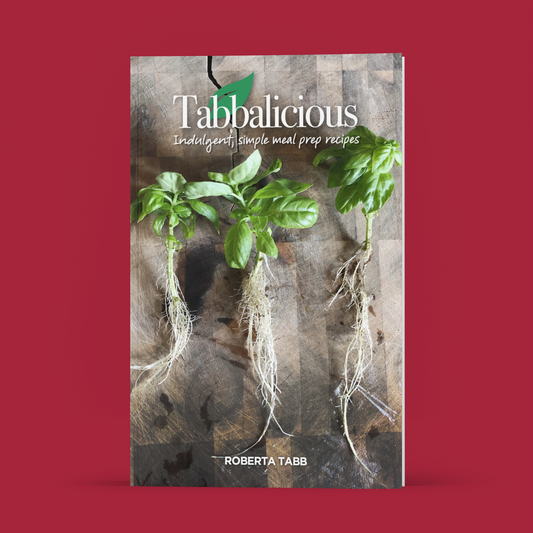 Book cover of 'Tabbalicious' with green leaves on a red background